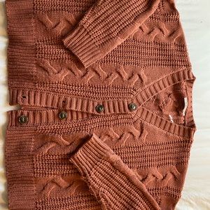 Francesca’s button up cardigan sweater in rust. Size small.